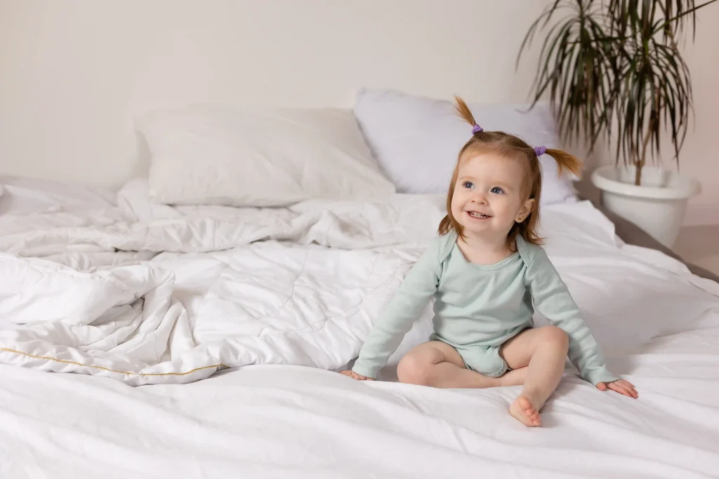 baby-sleeps-bed-with-white-sheets-concept-good-sound-baby-sleep-flat-lay-top-view-copy-space